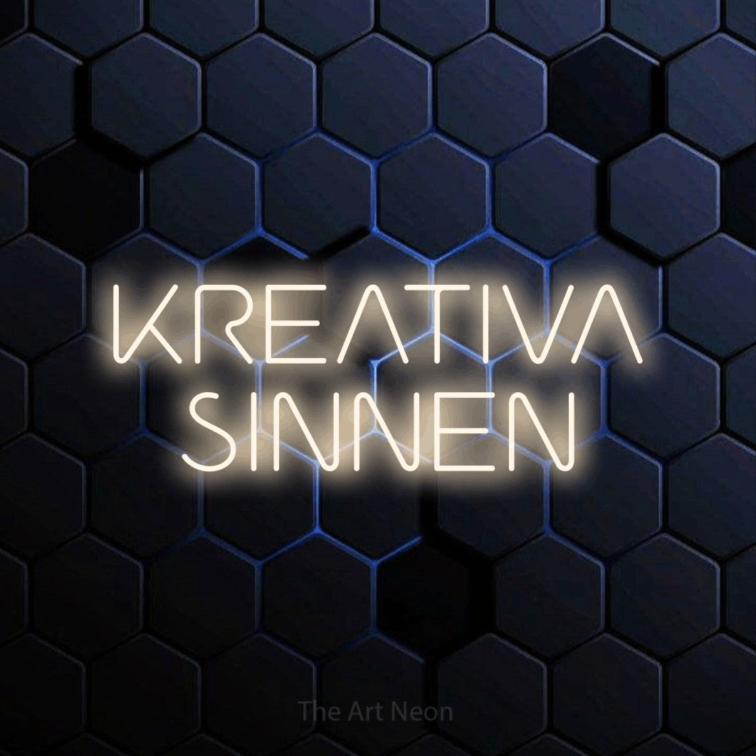 LED neon sign reading “KREATIVA SINNEN”, arranged in 2 lines.