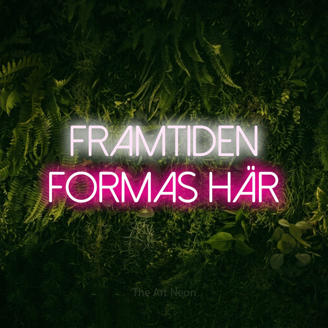 LED neon sign reading “FRAMTIDEN FORMAS HÄR”, arranged in 2 lines.