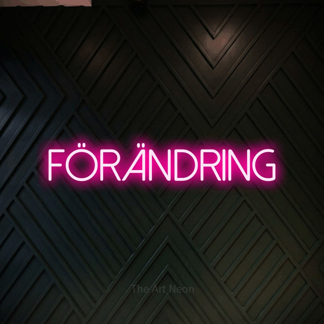 LED neon sign reading “FÖRÄNDRING”, arranged in a single line.