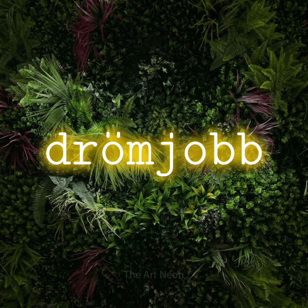 LED neon sign reading “drömjobb”, arranged in a single line.