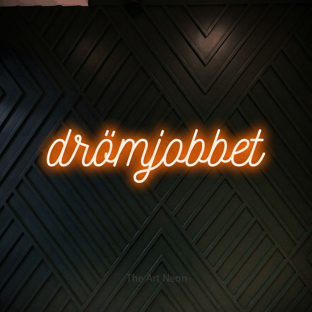 LED neon sign reading “drömjobbet”, arranged in a single line.