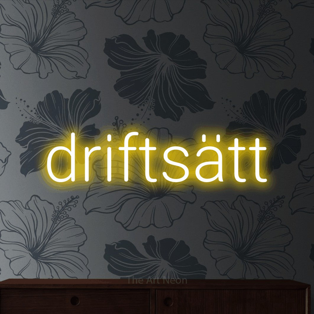LED neon sign reading “driftsätt”, arranged in a single line.