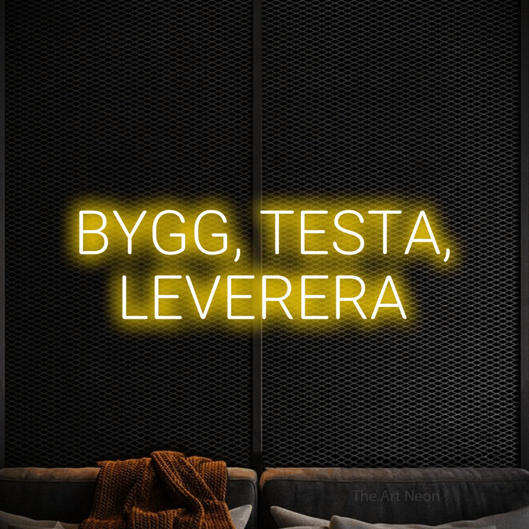 LED neon sign reading “BYGG, TESTA, LEVERERA”, arranged in 2 lines.