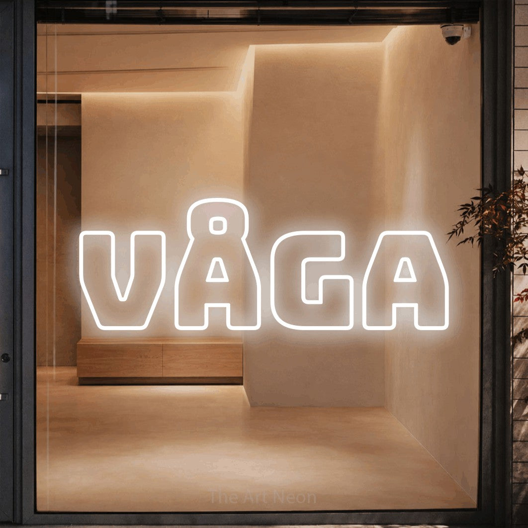 LED neon sign reading “Våga”, arranged in a single line.