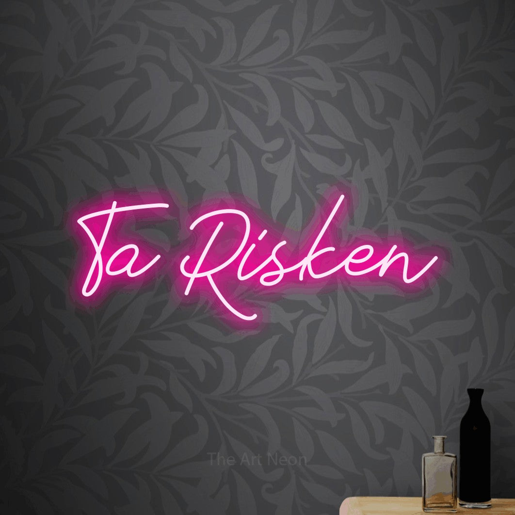LED neon sign reading “Ta Risken”, arranged in a single line.