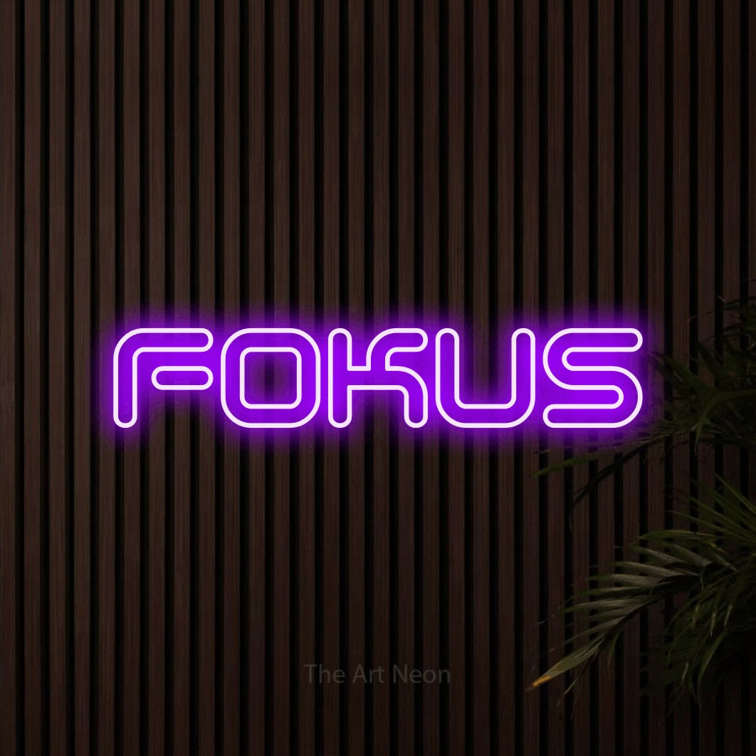 LED neon sign reading “FOKUS”, arranged in a single line.