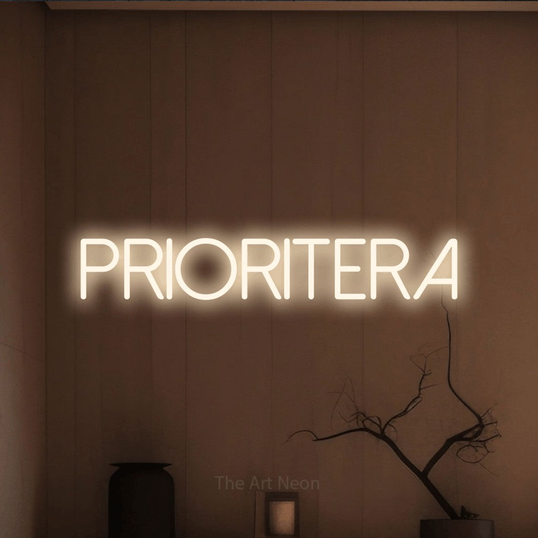 LED neon sign reading “Prioritera”, arranged in a single line.