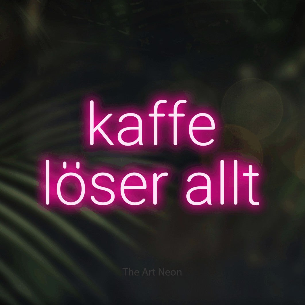 LED neon sign reading “kaffe löser allt”, arranged in 2 lines.