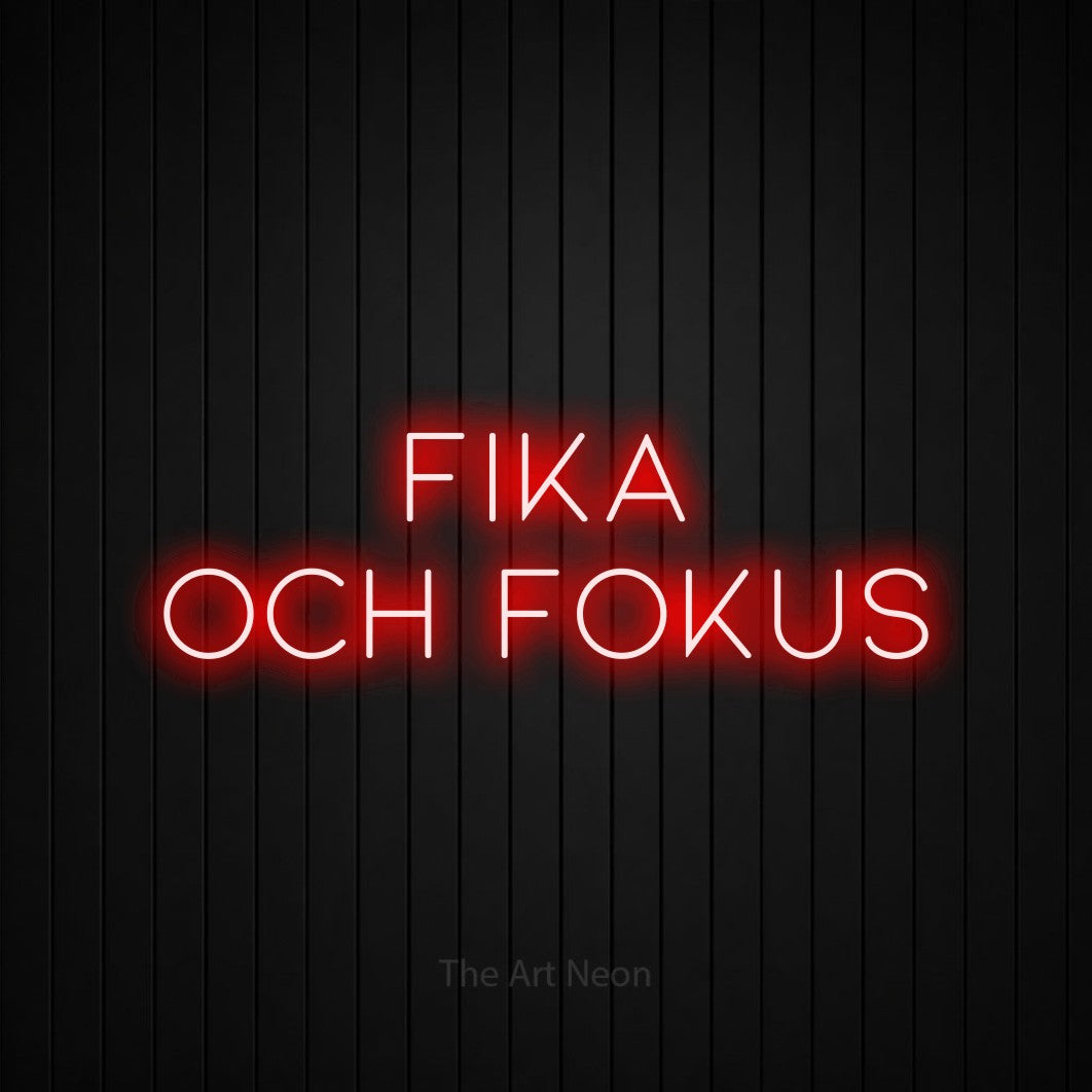 LED neon sign reading “fika och FOKUS”, arranged in 2 lines.