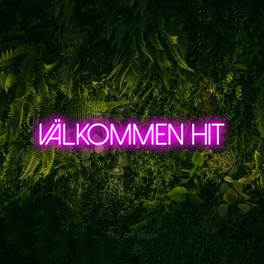 LED neon sign reading “välkommen hit”, arranged in a single line.