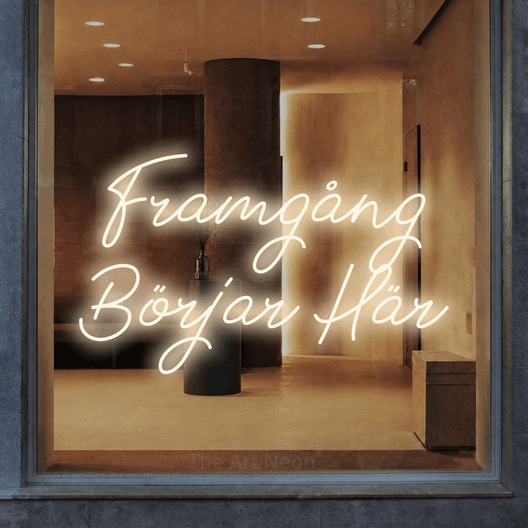 LED neon sign reading “Framgång Börjar Här”, arranged in 2 lines.
