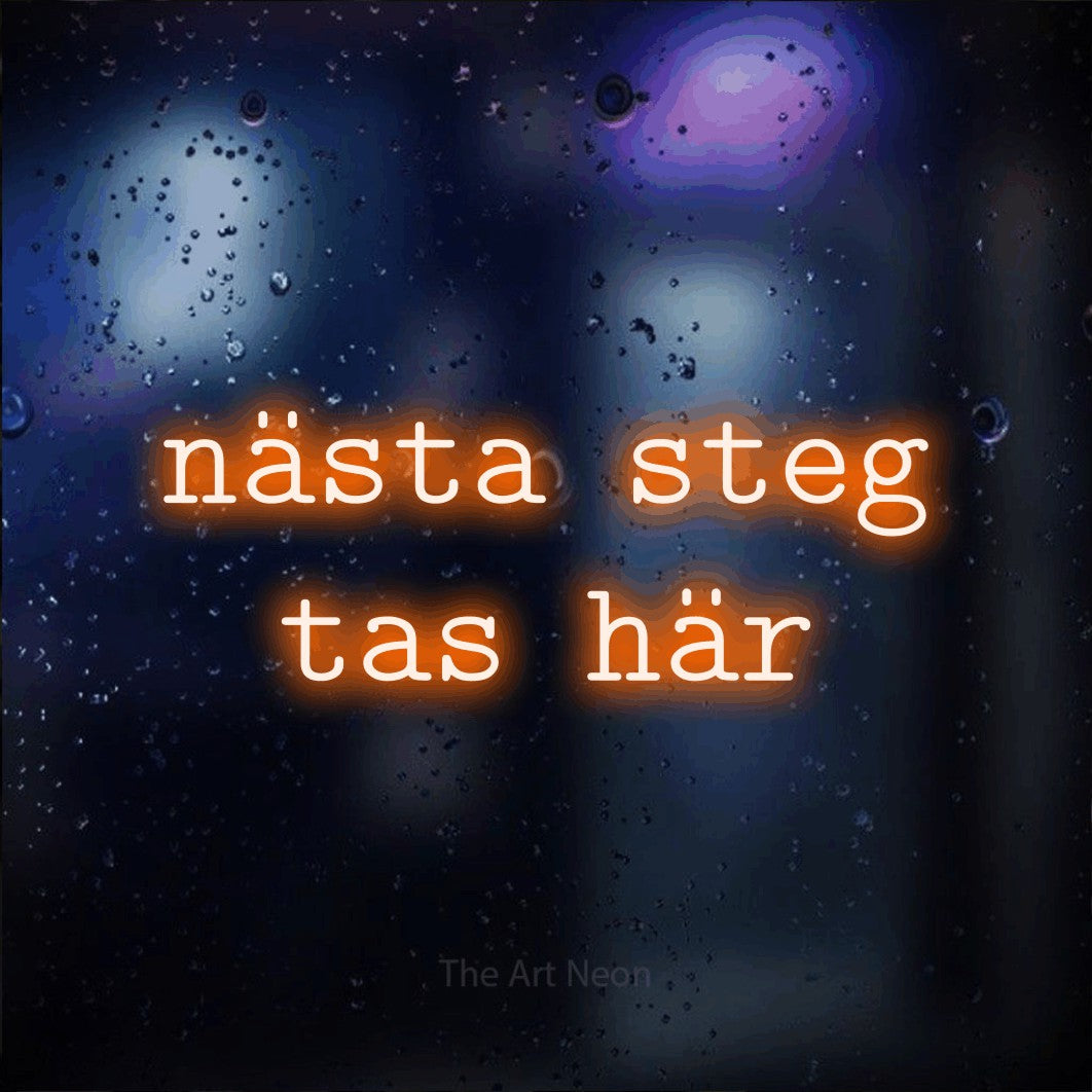 LED neon sign reading “nästa steg tas här”, arranged in 2 lines.