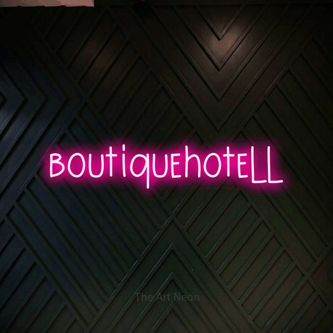 LED neon sign reading “boutiquehotell”, arranged in a single line.