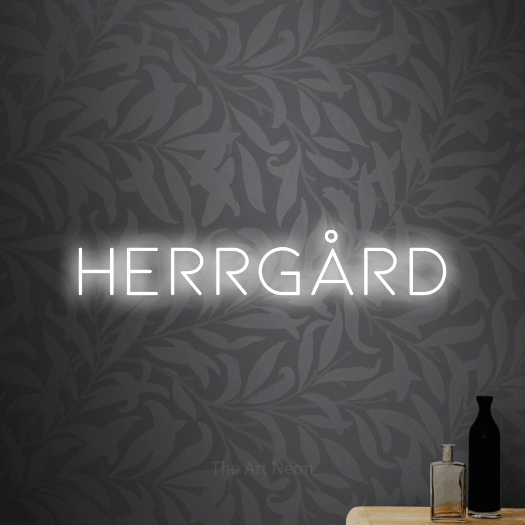 LED neon sign reading “HERRGÅRD”, arranged in a single line.