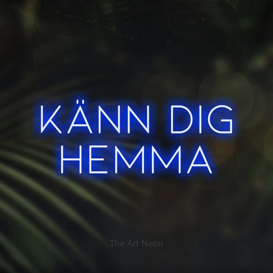 LED neon sign reading “KÄNN DIG HEMMA”, arranged in 2 lines.