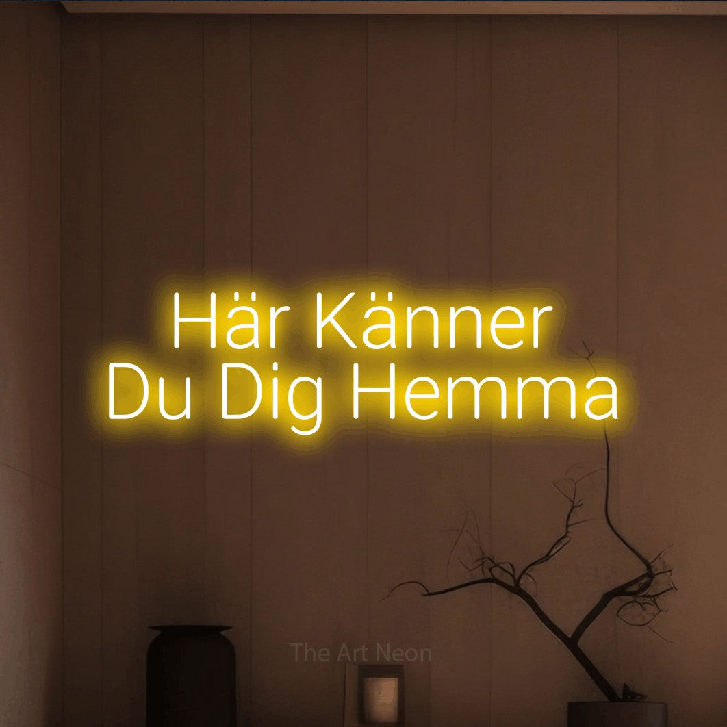 LED neon sign reading “Här Känner Du Dig Hemma”, arranged in 2 lines.