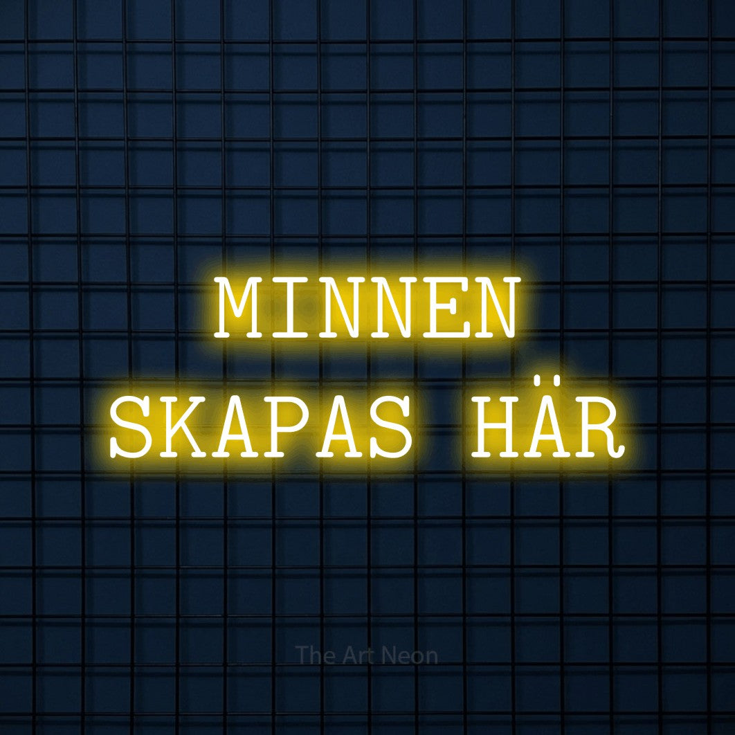 LED neon sign reading “MINNEN SKAPAS HÄR”, arranged in 2 lines.