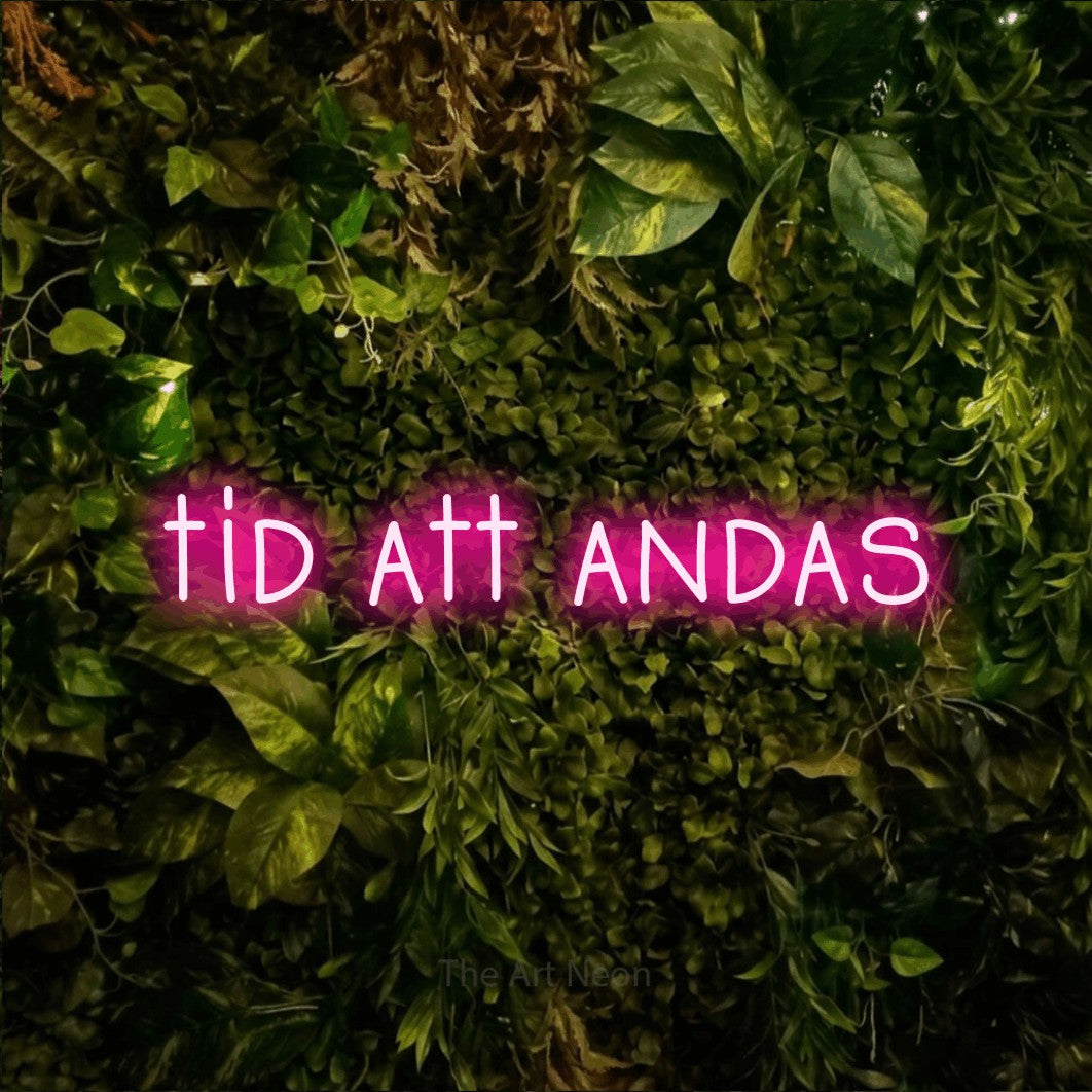 LED neon sign reading “tid att andas”, arranged in a single line.