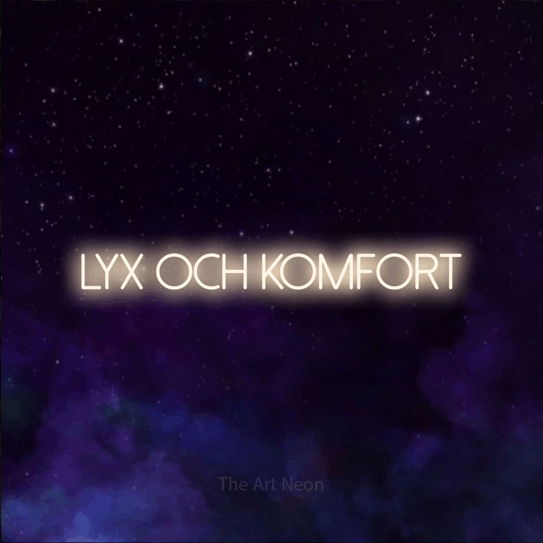 LED neon sign reading “lyx och KOMFORT”, arranged in a single line.
