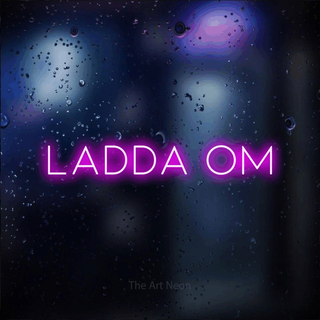 LED neon sign reading “ladda om”, arranged in a single line.