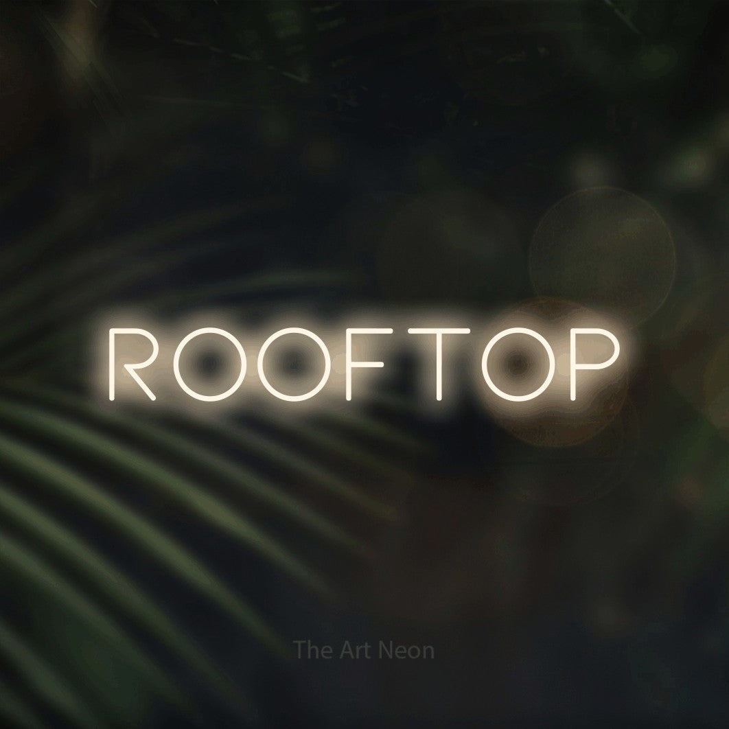 LED neon sign reading “ROOFTOP”, arranged in a single line.