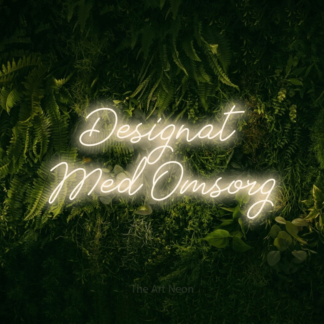 LED neon sign reading “Designat Med Omsorg”, arranged in 2 lines.