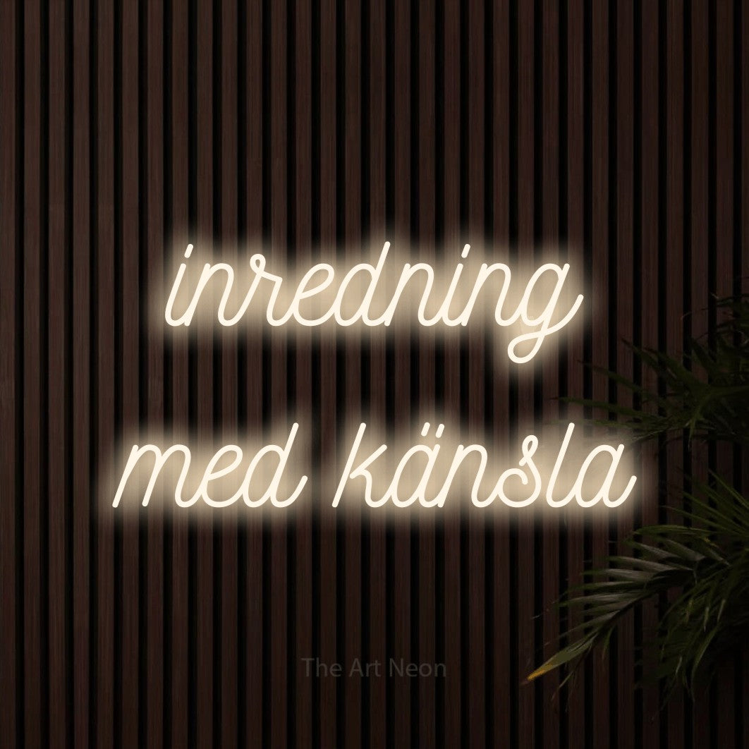 LED neon sign reading “inredning med känsla”, arranged in 2 lines.