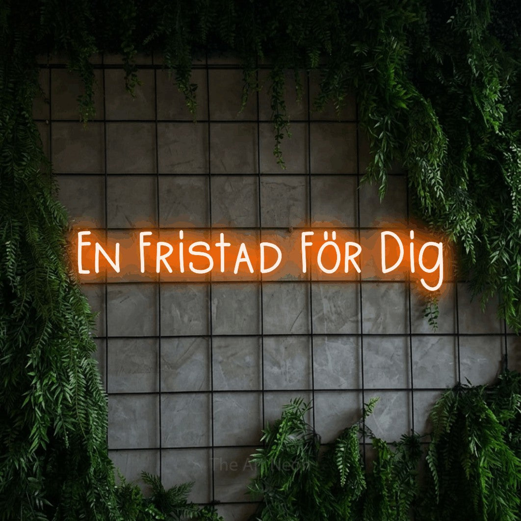 LED neon sign reading “En Fristad För Dig”, arranged in a single line.