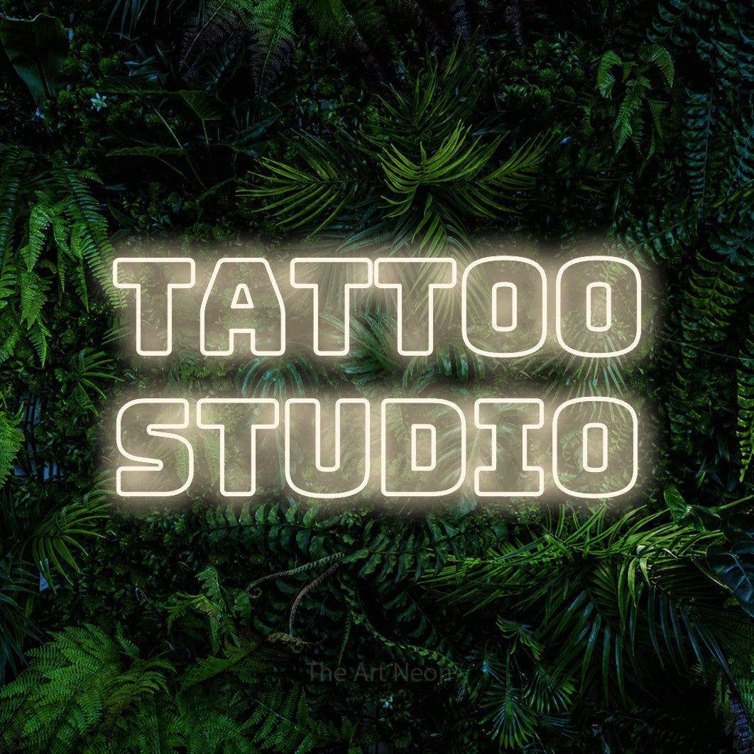 LED neon sign reading “Tattoo Studio”, arranged in 2 lines.