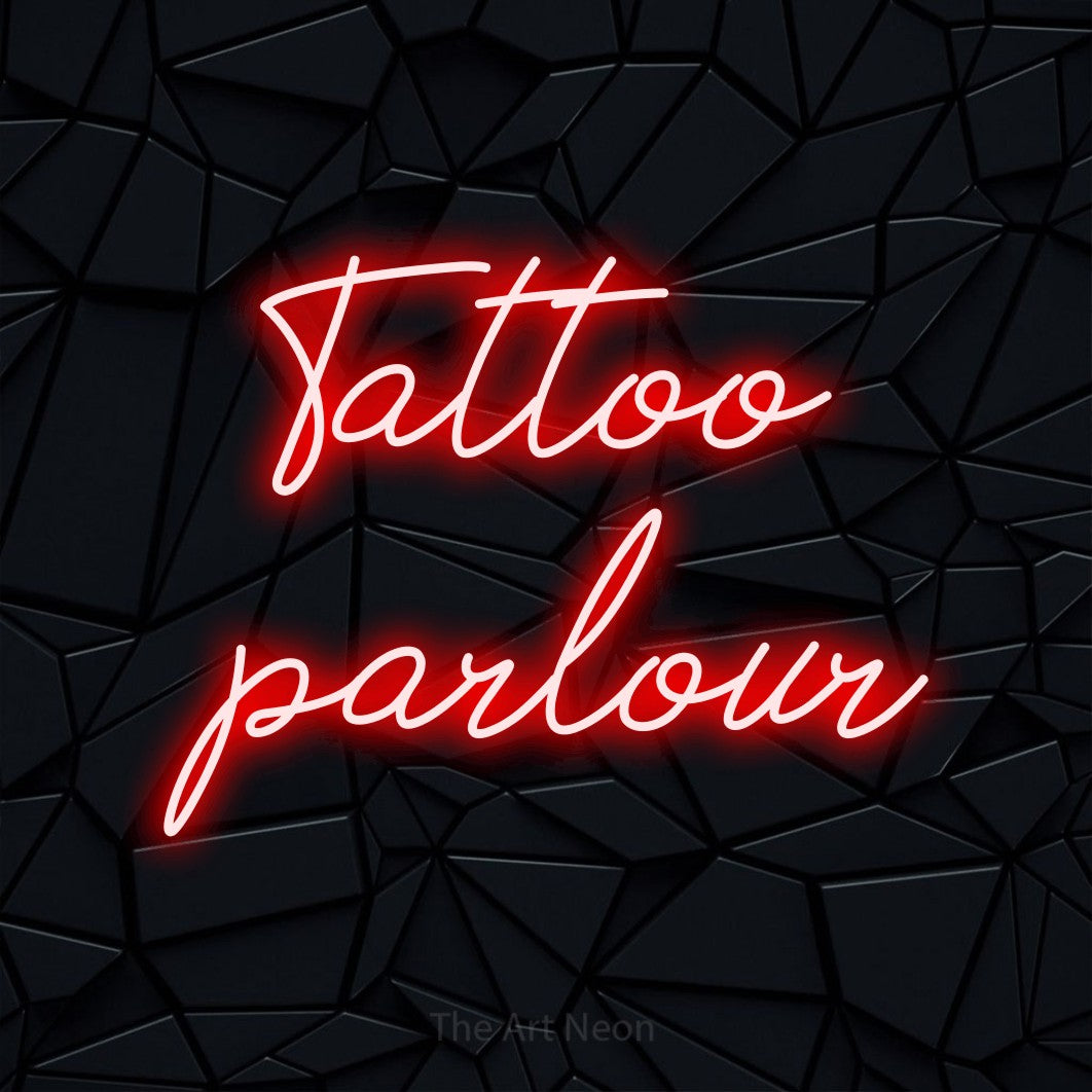 LED neon sign reading “Tattoo parlour”, arranged in 2 lines.