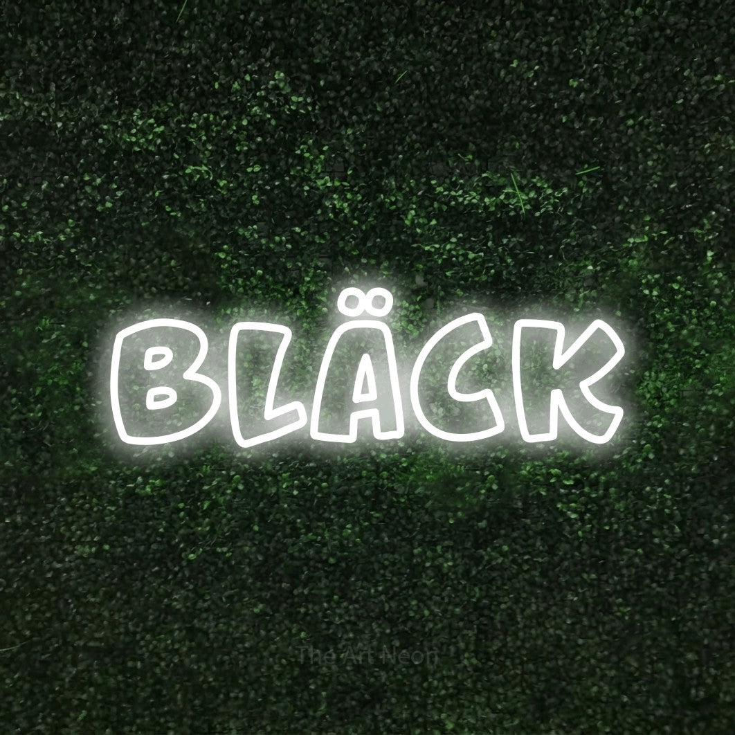 LED neon sign reading “bläck”, arranged in a single line.