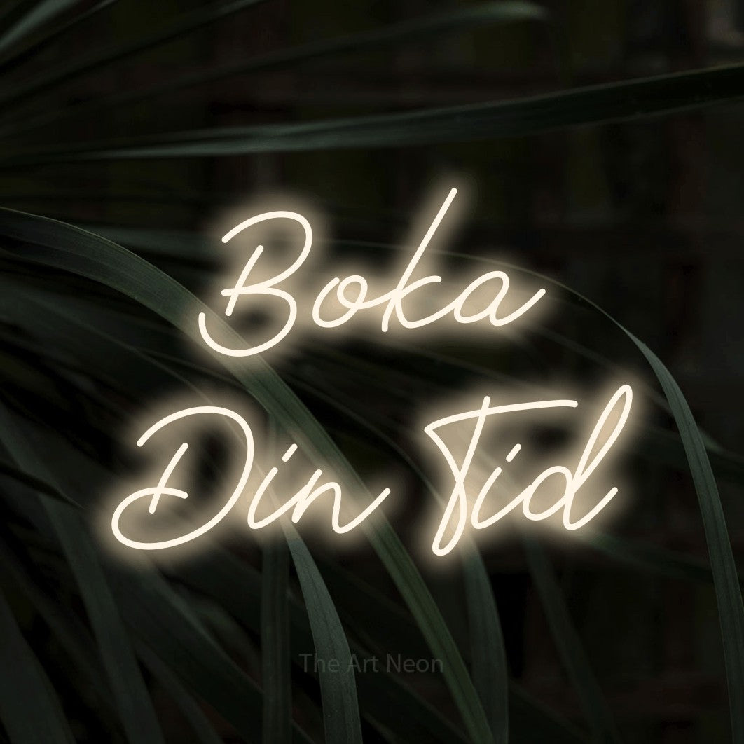 LED neon sign reading “Boka Din Tid”, arranged in 2 lines.