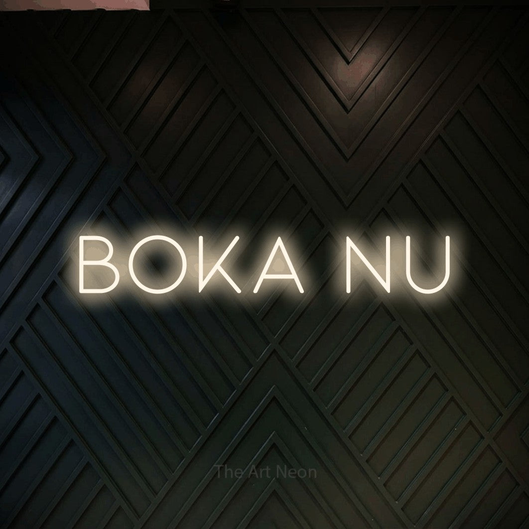 LED neon sign reading “boka nu”, arranged in a single line.