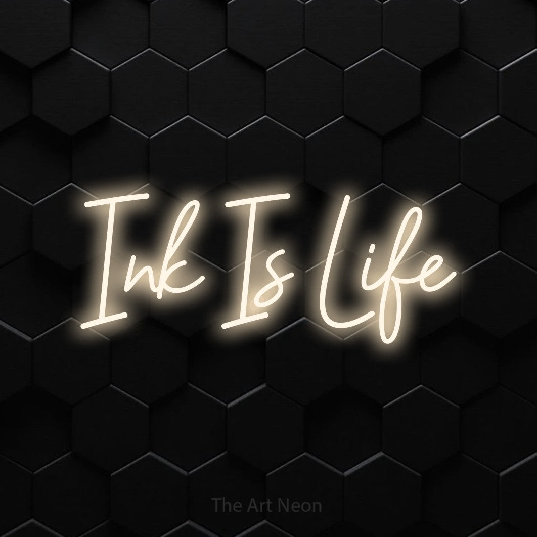 LED neon sign reading “Ink Is Life”, arranged in a single line.