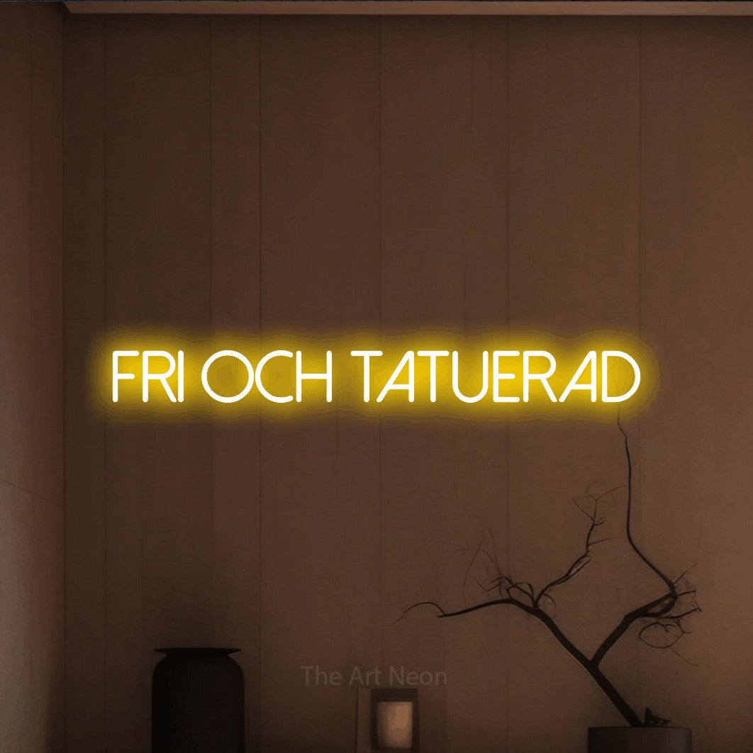LED neon sign reading “fri och tatuerad”, arranged in a single line.