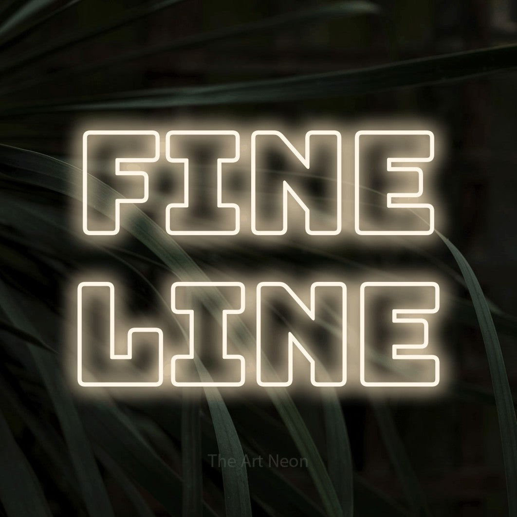 LED neon sign reading “Fine line”, arranged in 2 lines.