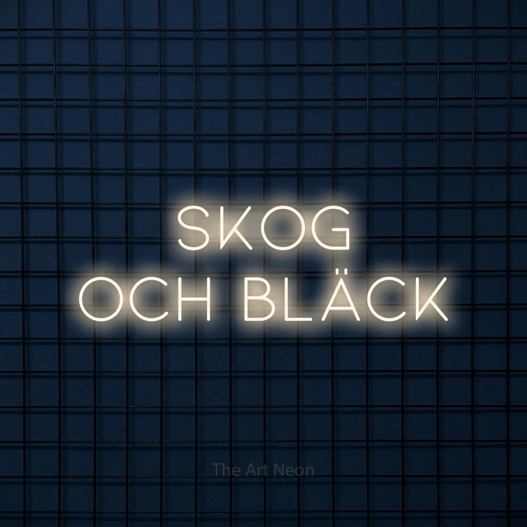 LED neon sign reading “SKOG OCH BLÄCK”, arranged in 2 lines.