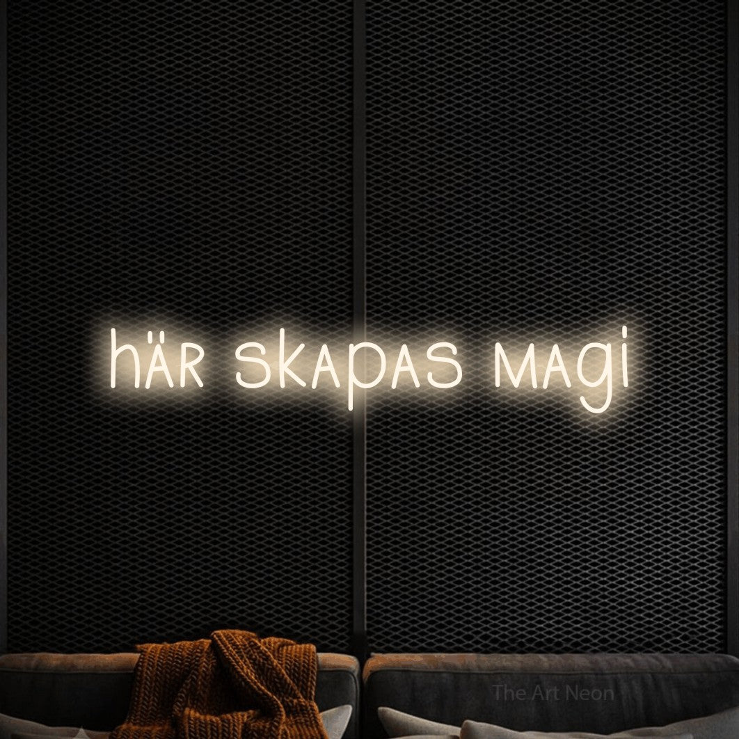 LED neon sign reading “här skapas magi”, arranged in a single line.