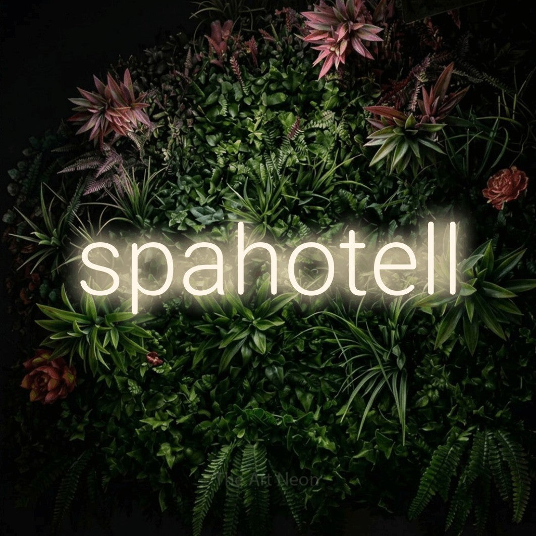 LED neon sign reading “spahotell”, arranged in a single line.