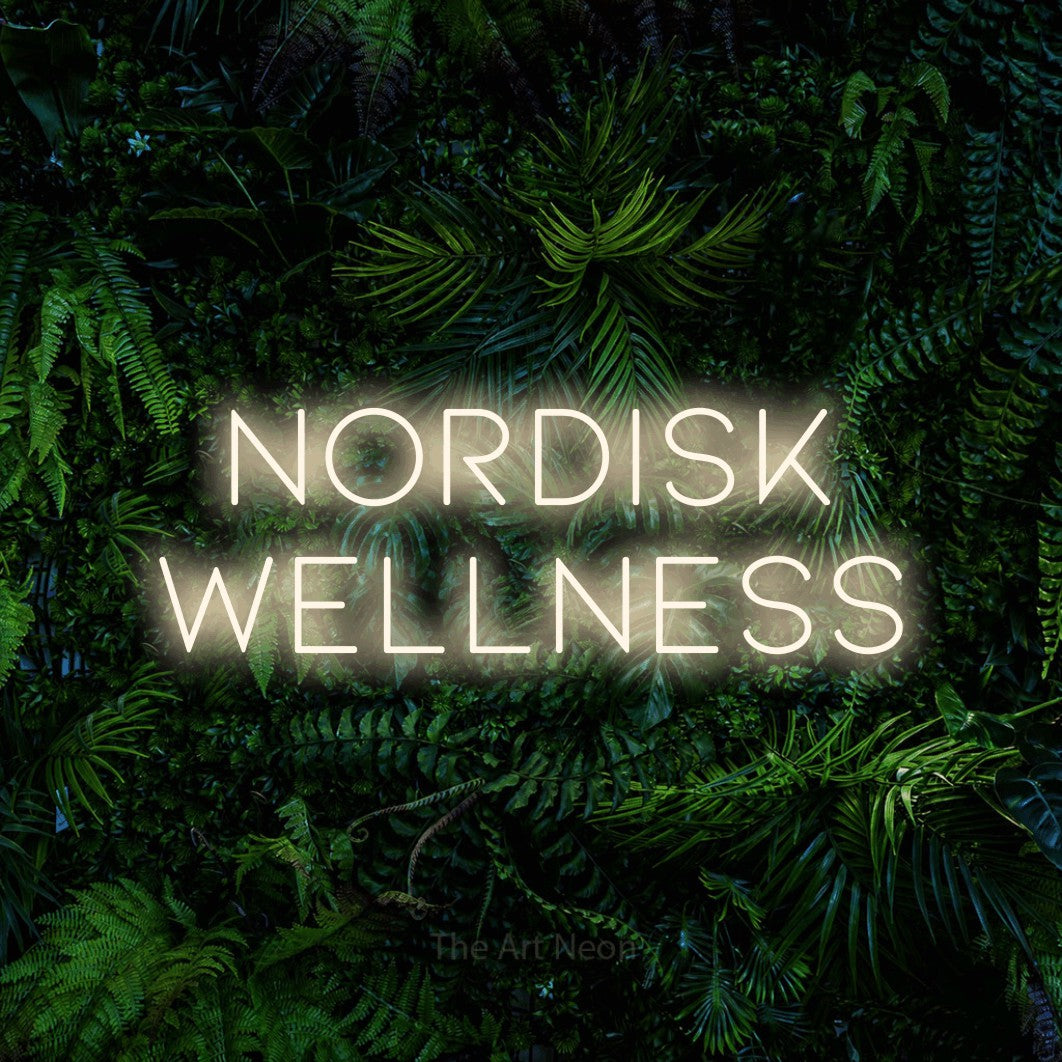 LED neon sign reading “Nordisk Wellness”, arranged in 2 lines.