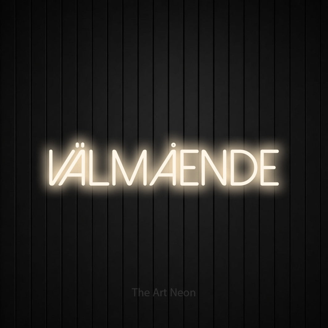 LED neon sign reading “VÄLMÅENDE”, arranged in a single line.