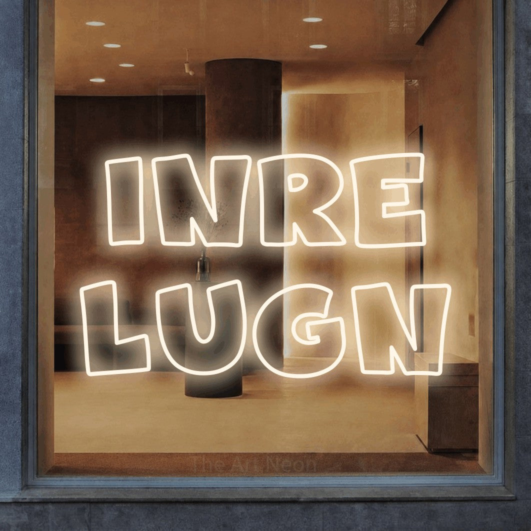 LED neon sign reading “inre lugn”, arranged in 2 lines.