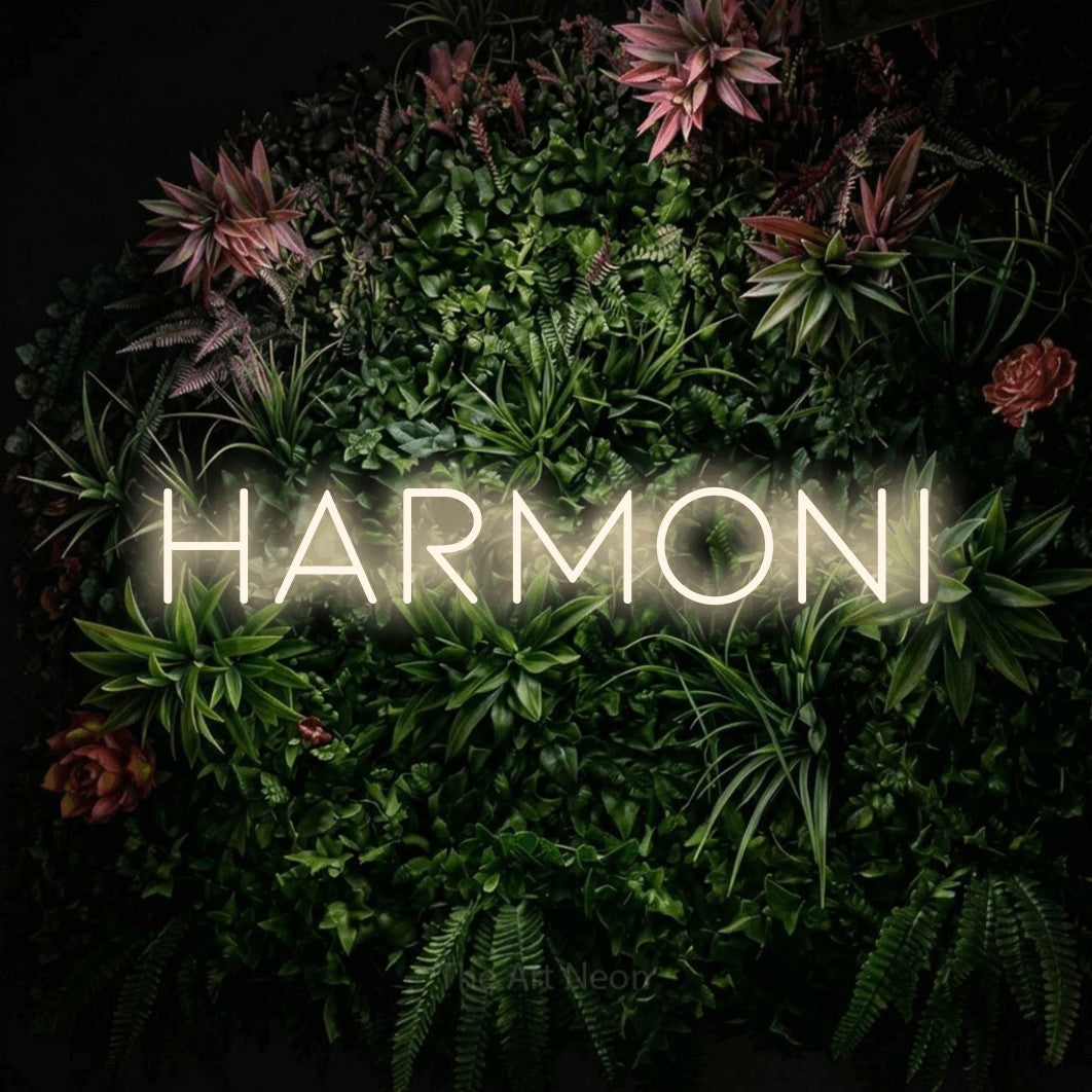 LED neon sign reading “Harmoni”, arranged in a single line.