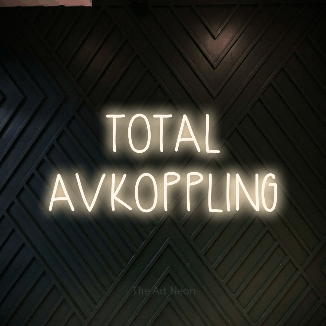 LED neon sign reading “TOTAL AVKOPPLING”, arranged in 2 lines.
