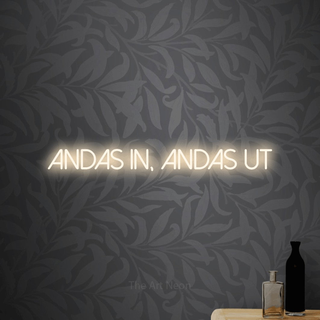 LED neon sign reading “andas in, andas ut”, arranged in a single line.