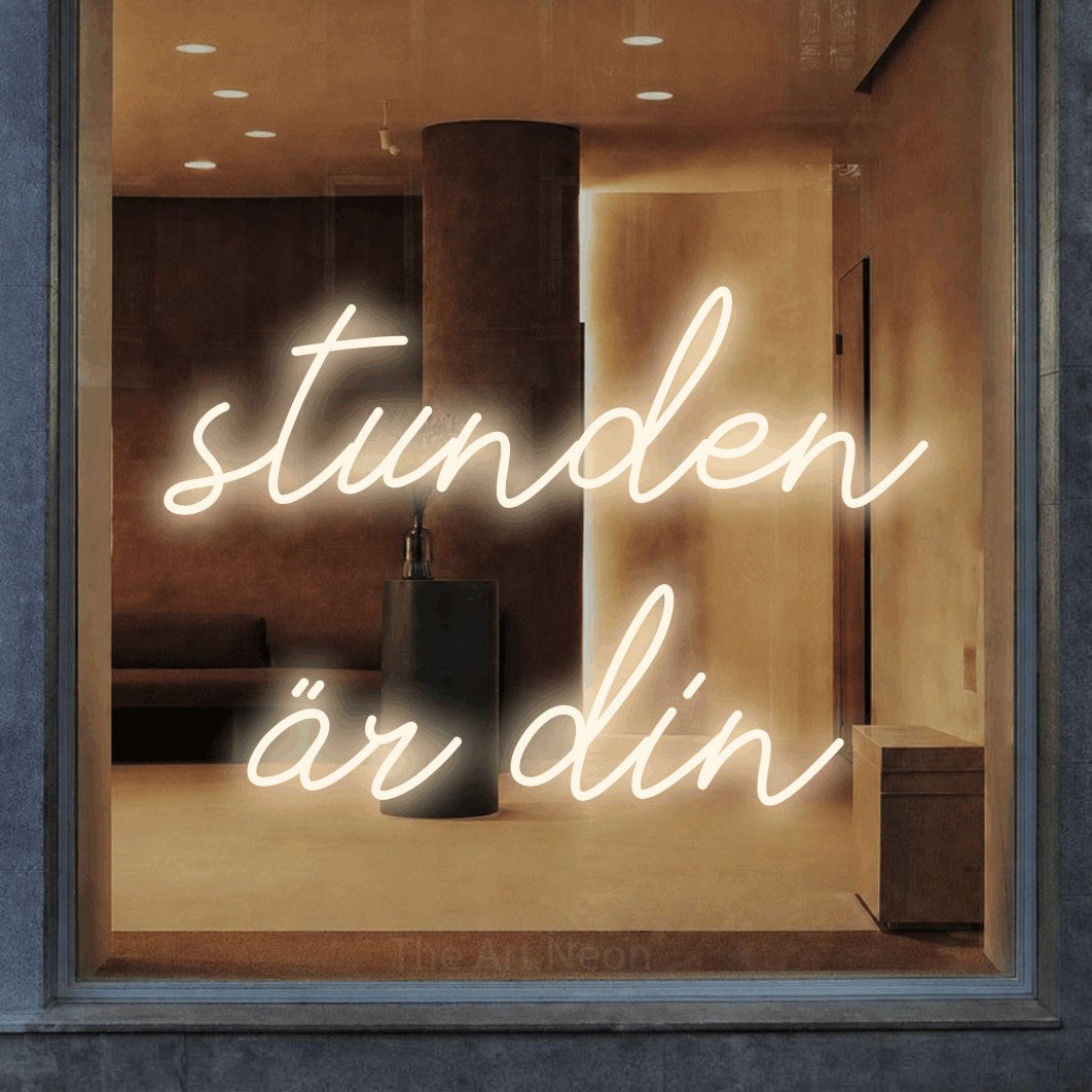 LED neon sign reading “stunden är din”, arranged in 2 lines.