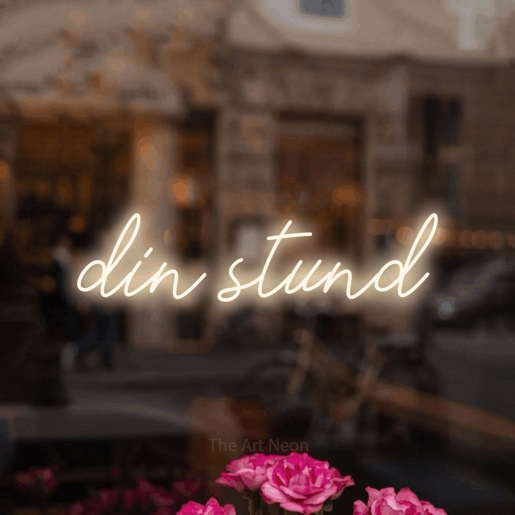 LED neon sign reading “din stund”, arranged in a single line.