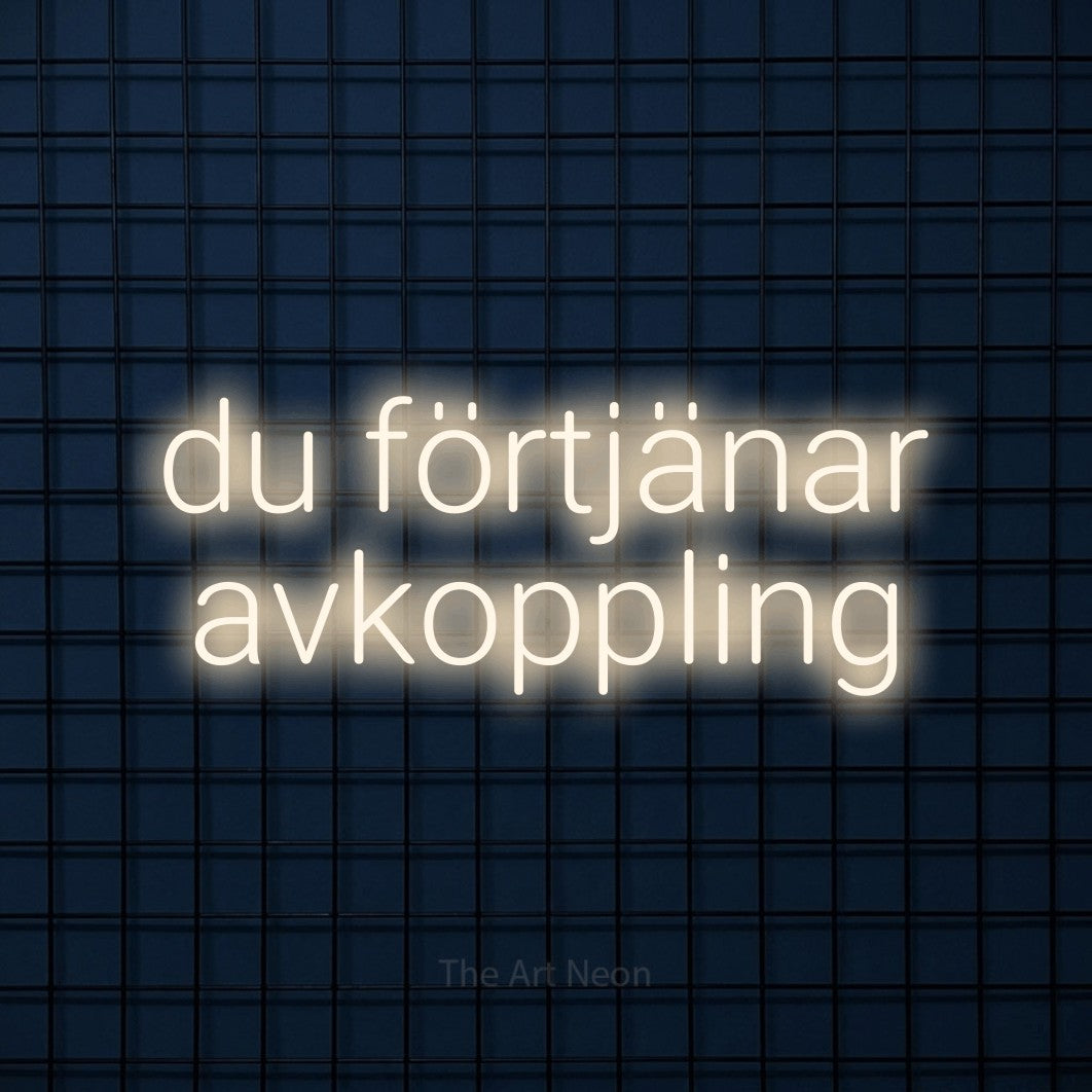 LED neon sign reading “du förtjänar avkoppling”, arranged in 2 lines.