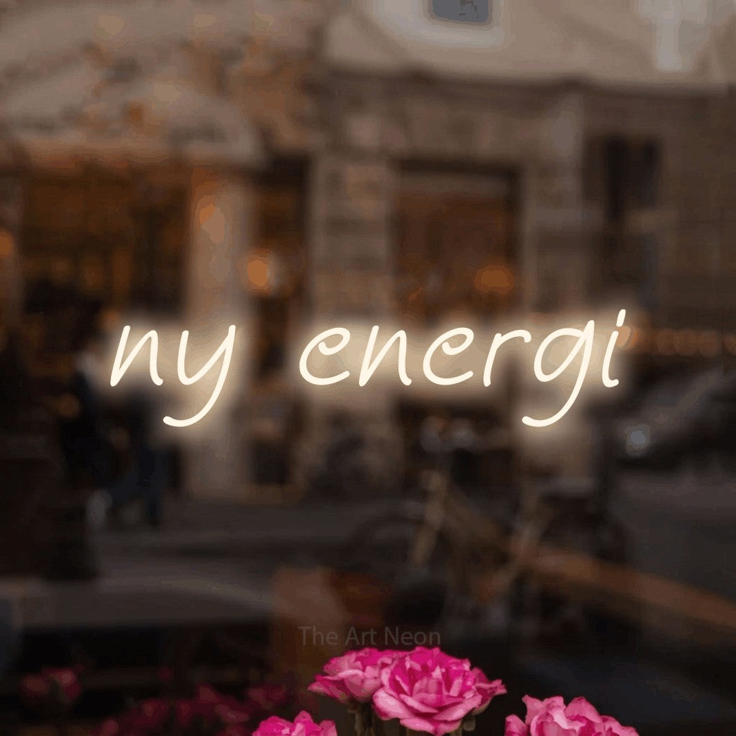 LED neon sign reading “ny energi”, arranged in a single line.