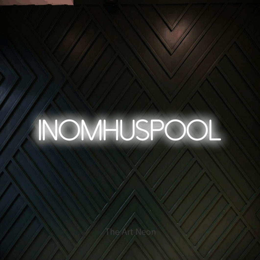 LED neon sign reading “INOMHUSPOOL”, arranged in a single line.